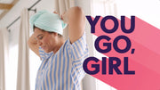Woman wearing an aqua microfiber Turbie twist hair towel. Text reads: "you go, girl"